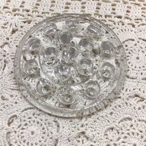 Vintage clear glass 16 hole flower frog.